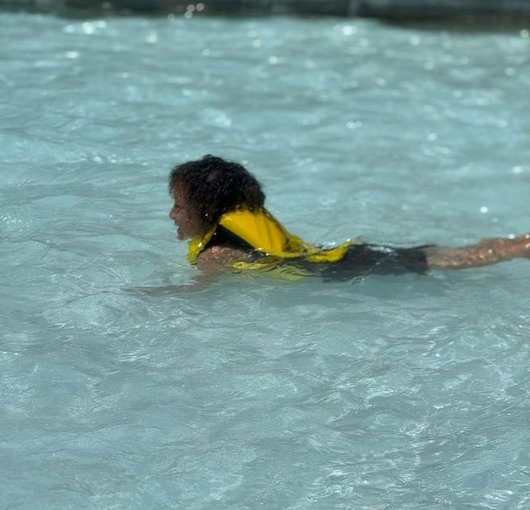 School-age child swimming in the pool